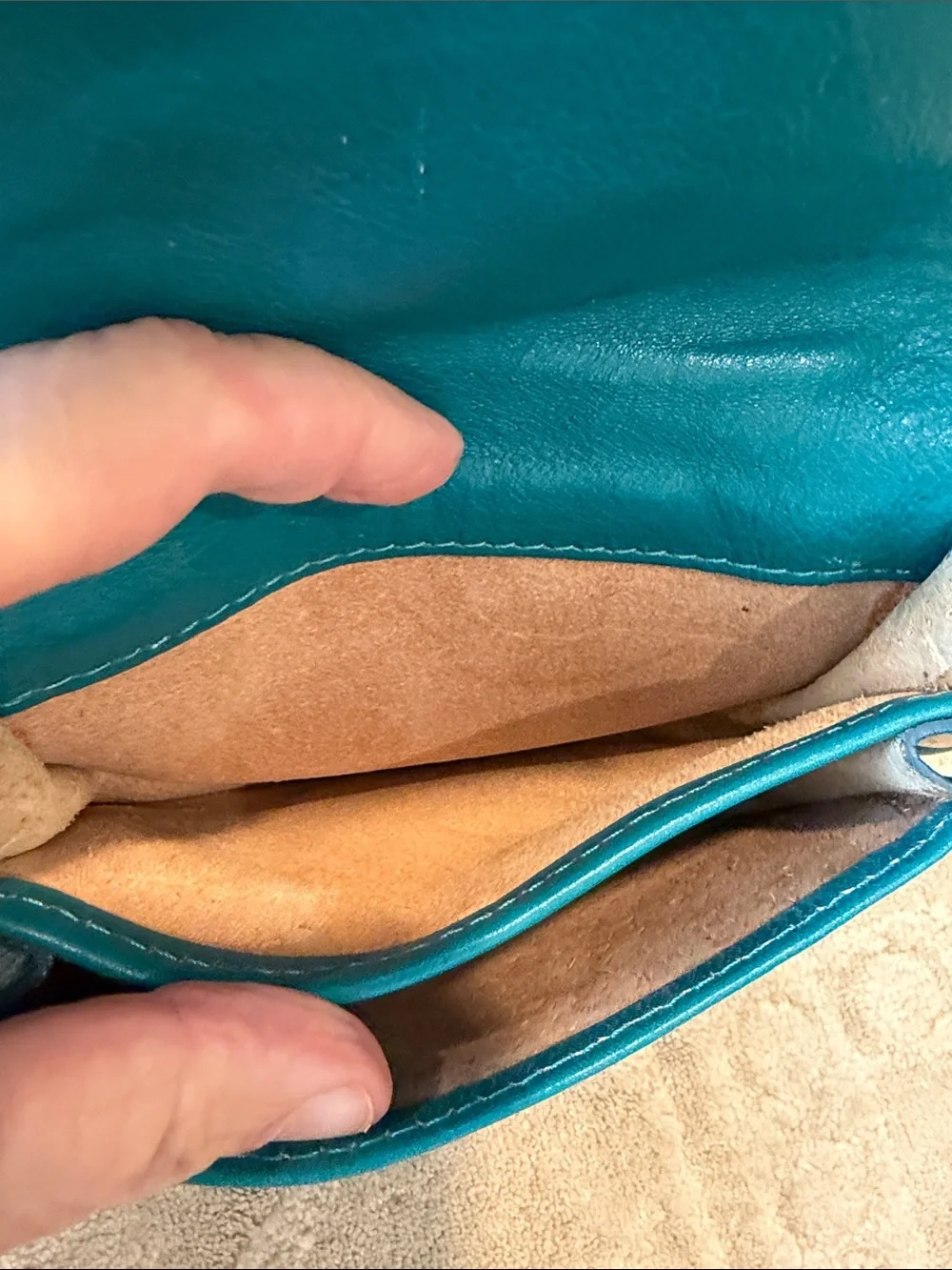 Vintage Florence Made in Italy genuine leather crossbody saddle bag in teal.